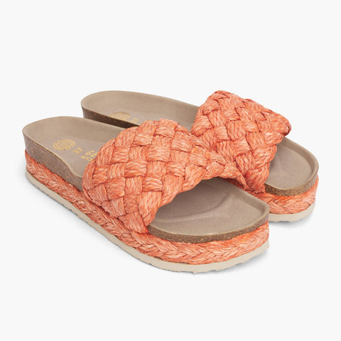 Orange raffia platform sandals with single foot strap and braided sole detail