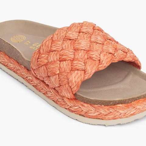 Orange raffia platform sandal with single foot strap and braided sole detail