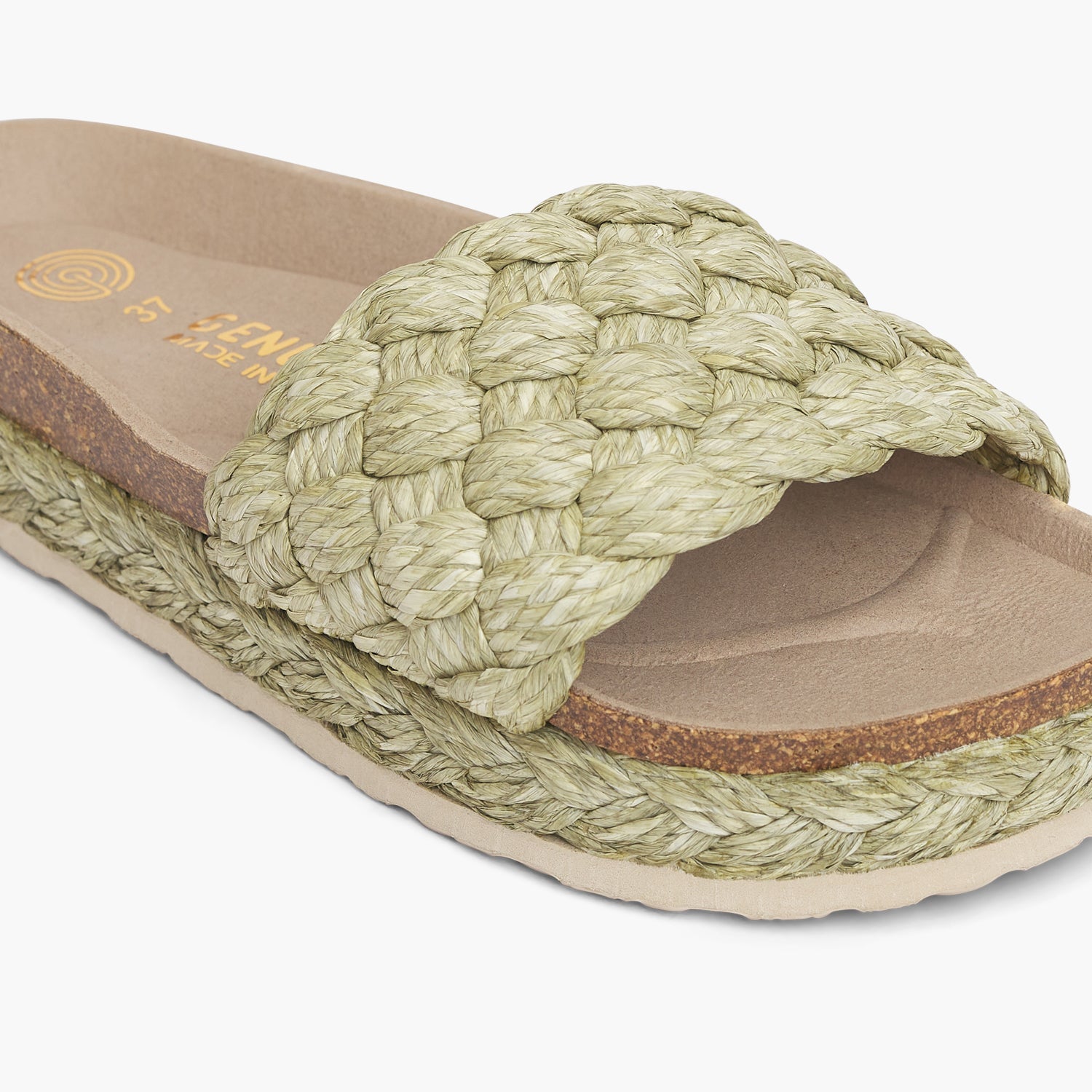 Green raffia platform sandal with single foot strap and braided sole detail